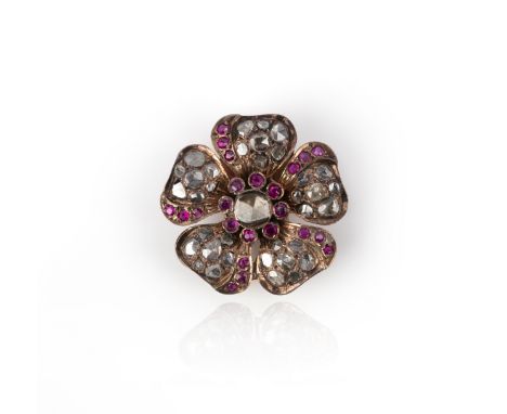 A diamond and synthetic ruby brooch, designed as a flower, set with rose-cut diamonds and synthetic rubies, diameter 3cm