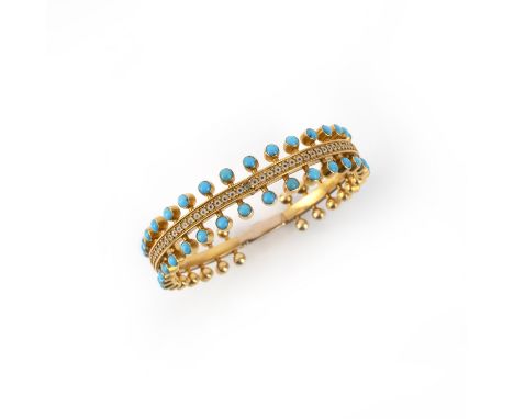 Phillips Brothers, a turquoise and enamel gold bangle, c1870, set with a central panel of circular enamel decoration within g