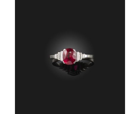 An Art Deco ruby and diamond ring, 1930s, set with an oval ruby weighing 1.36 carats, to stepped shoulders set with baguette 