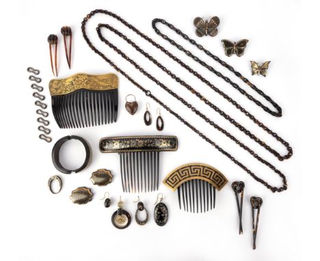 λ A large group of tortoiseshell jewels and accessories, 18th and 19th century, comprising: three haircombs, one with a Japan