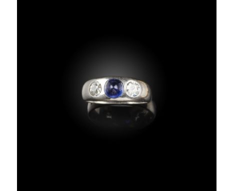 A sapphire and diamond-set gypsy ring, the sugarloaf sapphire set within old circular-cut diamonds in platinum, size R