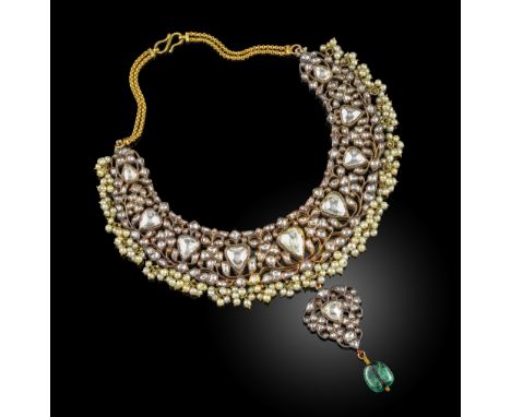 A diamond, emerald, enamel and pearl necklace, India, designed as an articulated collar of  foliate scrollwork set with lasqu