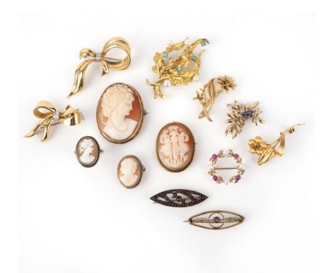 A group of brooches and a ring, comprising: two 18ct gold diamond bow brooches, two 18ct floral brooches set with turquoise a