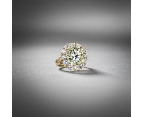 Van Cleef &amp; Arpels, a Fancy Light Yellow diamond cluster ring, set with a fancy coloured old circular-cut diamond weighin