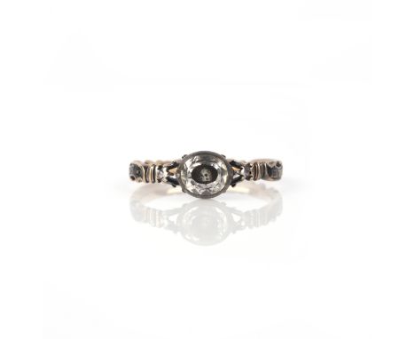 A Stuart crystal mourning ring, circa 1748, set with a faceted oval rock crystal covering a skull on a ground of woven hair, 