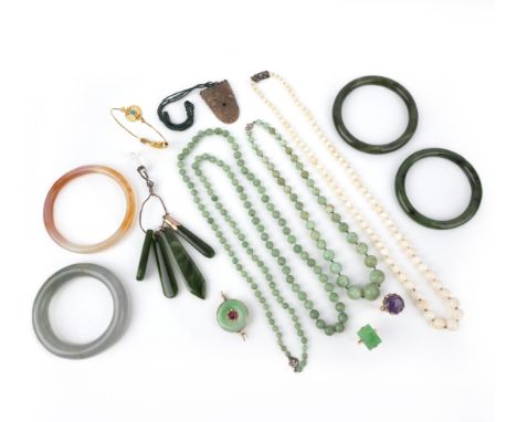 λ A collection of jewellery including a jadeite bangle, comprising: a white and russet jadeite bangle; a light bluish green j