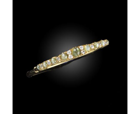 A Victorian cat's eye chrysoberyl and diamond bangle, late 19th century, of hinged design, the front set with graduated cat's