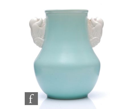 Attributed to John Adams - Poole Pottery - A 1930s Art Deco shape 504 vase glazed in ice blue with fan tail dove handles, imp