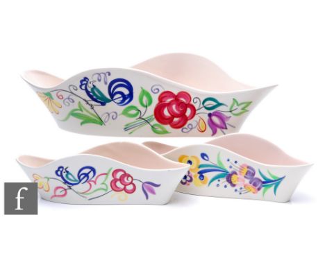 Poole Pottery - Three Freeform wavy edged planters decorated in traditional floral patterns, printed marks, longest length 34