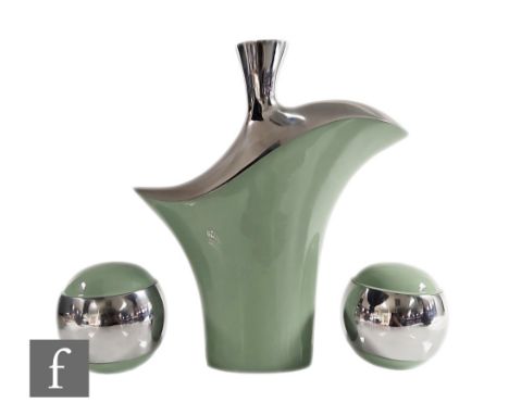 Unknown - A contemporary bright metal vase of abstract form, decorated with pale green enamel, height 32cm, together with a p