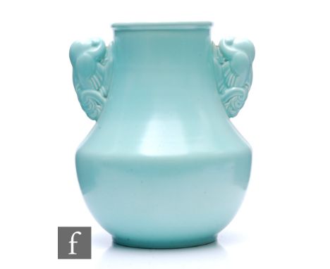 Attributed to John Adams - Poole Pottery - A 1930s Art Deco shape 503 vase glazed in ice blue with fan tail dove handles, imp