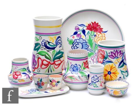 Poole Pottery - A group of ten 1960s ceramic items all with hand painted floral decoration comprising five vase of various si