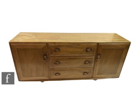 Lucian Ercolani for Ercol Furniture - A Windsor blonde elm sideboard, model 455, fitted with an arrangement of three central 