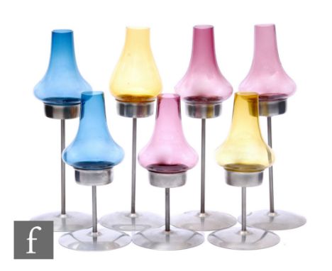 Old Hall - A group of post war stainless steel night light, candle holders, each with a wide circular base, slender stem and 