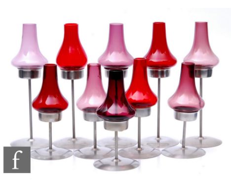 Old Hall - A group of post war stainless steel night light, candle holders, each with a wide circular base, slender stem and 