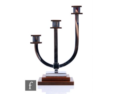 Unknown - A 1930s Art Deco three sconce candlestick in chrome with brown detailing to the scones and stepped base, tallest he