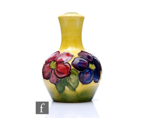 Moorcroft Pottery - A small lamp base, of ovoid form with tall flared neck, decorated in the Yellow Anemone pattern with a ba