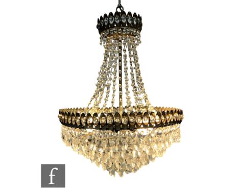 Schonbek Luminaire - A 1970s six-light chandelier, the eight-tier gild metal frame with concentric cornice, adorned with crys