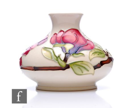 Moorcroft Pottery - A small vase of squat ovoid form with flared neck, shape 32/5, decorated in the Magnolias pattern with la