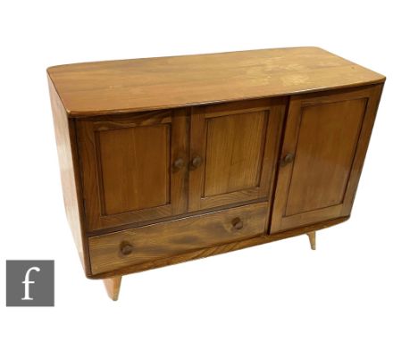 Lucian Ercolani for Ercol Furniture - A model 366 Windsor elm sideboard, fitted with a double door cupboard, a single drawer 