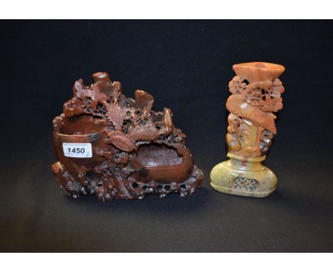 A red soapstone Oriental carving, pierced work bowls and chrysanthemums; another similar candlestick, crane supporting bowl (