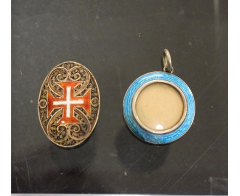 A silver and enamel locket; a silver gilt and enamel brooch