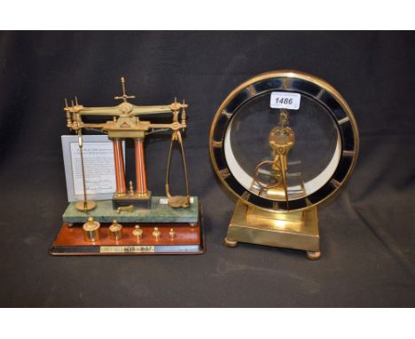 A Kundo mantel clock, battery operated; a Franklin Mint 150th anniversary California Gold Rush balance scale, certificate (2)