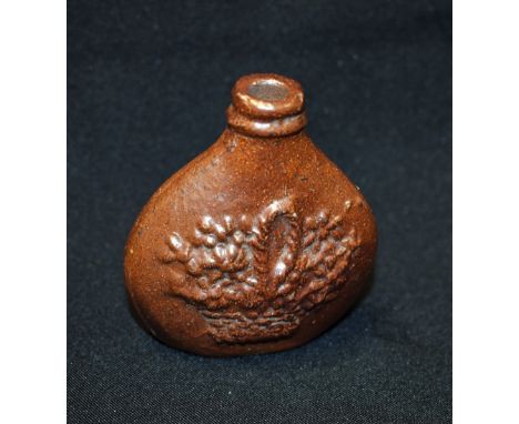 A 19th century brown saltglazed stoneware oval flask, possibly Brampton, moulded in low relief with a basket of country flowe