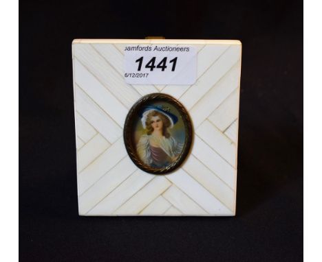 English School, late 19th century miniature, of a lady wearing a blue bonnet, on ivory, overpainted print, gilt metal mount, 