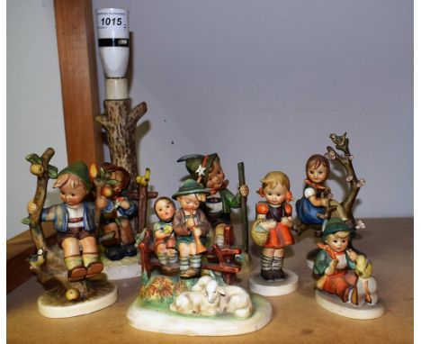 A Goebel Hummel ceramic table lamp, She Loves Me, She Loves Me Not; others, figures including Mountaineer, Apple Tree Boy, Ev