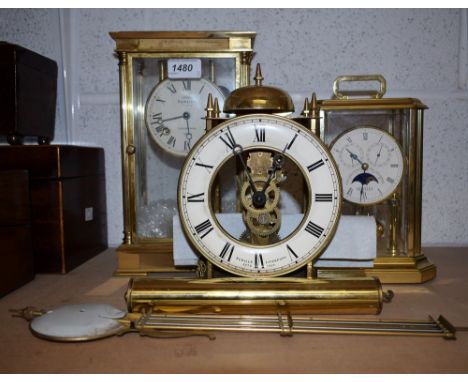 A Sewills of Liverpool brass lantern wall clock, instructions; a Sewills brass portico type mantel clock; another smaller Sew