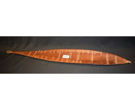Tribal Art - an Australian Aboriginal hardwood woomera spear thrower, of typical broad leaf shape and incise carved with band