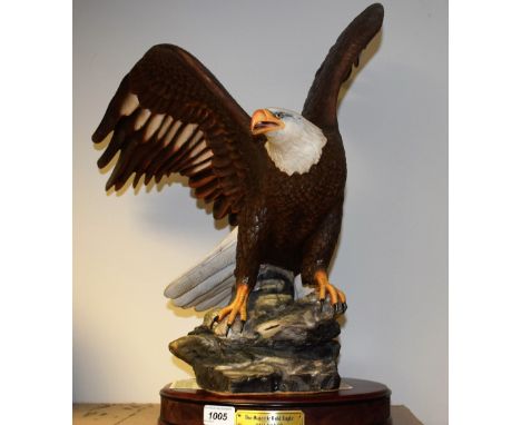 A Franklin Mint ceramic model, The Majestic Bald Eagle, First Edition, modelled by Ronald Van Ruyckevelt, number A5544, 55cm,