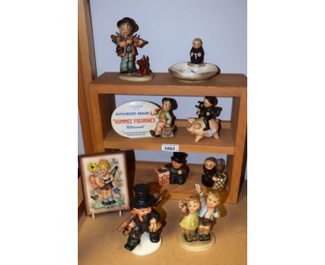A Goebel Hummel ceramic figure, Auf Wiedersehen; others, Puppy Love, Chimney Sweep On Pig, advertising dealer sign, etc (9)