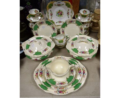 A Staffordshire Grosvenor tea set for six, printed with rosebuds; a James Kent Sandringham pattern dinner service, number 301