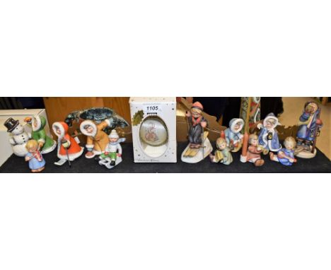 A Goebel Hummel ceramic figure, Skier; others, Hear Ye Hear Yea Boy, Angel candlesticks, Girl and Snowman, etc; a Hummel glas