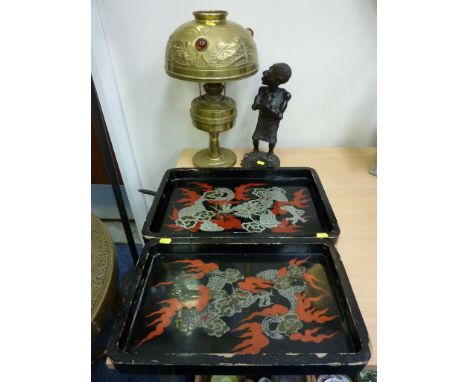 Arts and Crafts brass oil lamp, carved African figure and two oriental design lacquer trays 