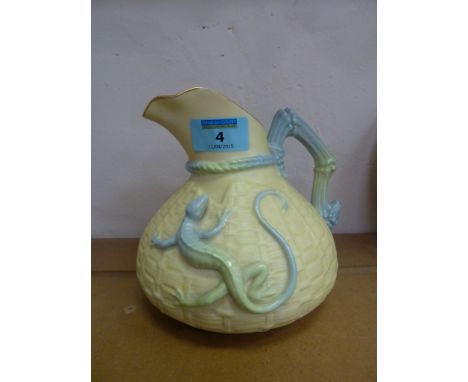 A Royal Worcester 'Lizard' jug, moulded with a pale blue and green lizard on a basket weave ground H16cm 