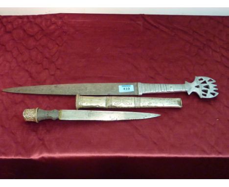 Javanese short sword 56cm and an eastern dagger with single edge 25cm blade and embossed metal scabbard 