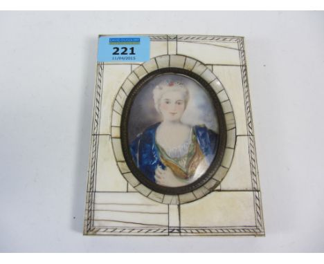 Late 19th/early20th century oval portrait miniature of a lady with jeweled hair in a blue cape signed 8cm