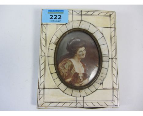 Late 19th/early20th century oval portrait miniature of a lady with spaniel signed 8cm