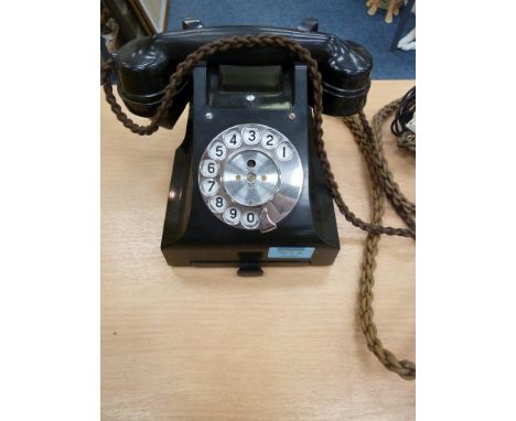 Vintage bakelite rotary dial telephone