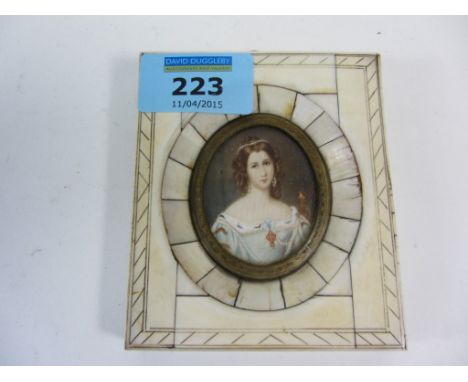 Late 19th/early20th century oval portrait miniature of a lady in light blue dress 4.5cm