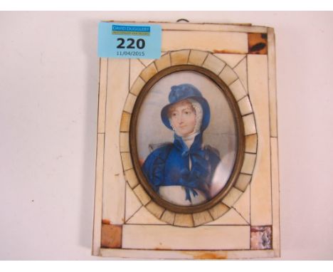 Late 19th/early20th century oval portrait miniature of a lady in a blue cape 8cm