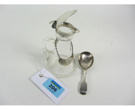 Edwardian whisky jug with hallmarked lid and label and a silver caddy spoon