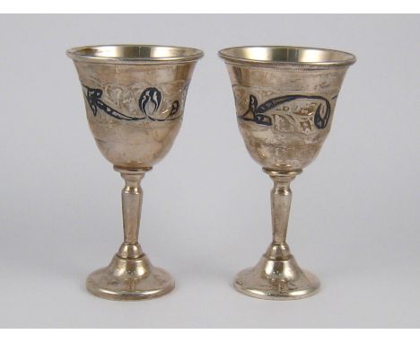 A pair of Soviet 875 standard silver niello vodka cups. ht.8cm. wt. 92gm. 