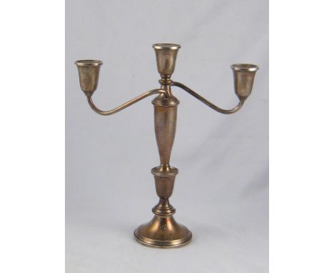 An American silver three light candelabrum by Towle, marked sterling silver. 26cm. across x 30cm. high. 