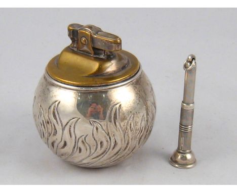 A silver "Witchball" table cigarette lighter, Richard Comyns, London 1957, 7cm. diameter, the lighter mechanism plated, toget