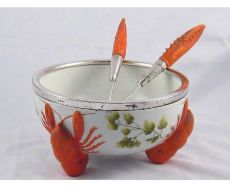 W.M.F. A ceramic bowl, the supports three lobsters, with plated rim , 21cm. across, with pair of matching servers, the handle