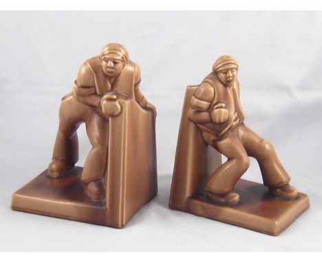 A pair of German 1920s ceramic bookends representing toiling workers. Well struck Engers mark on each. Ht.23cm. 